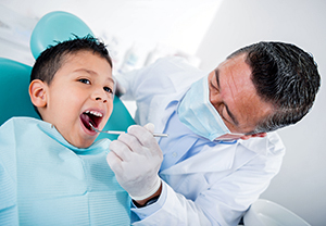 Boy being examined by dentist.