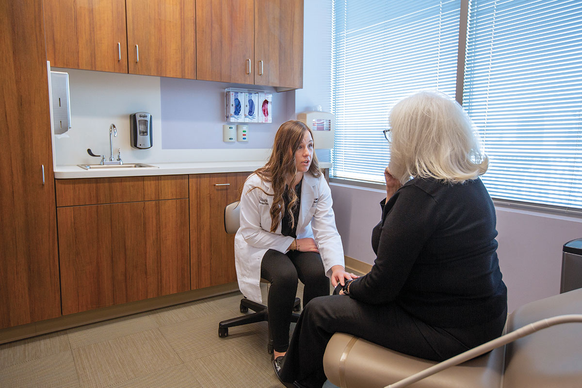 Urogynecologist, Sara Wood, MD, MHPE, meets with a patient to discuss treatment options