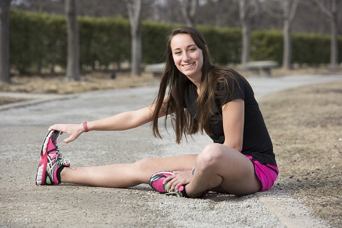 McKenzie Ozee stretching before a run