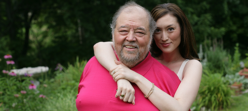 A daughter embraces her father A daughter embraces her father
