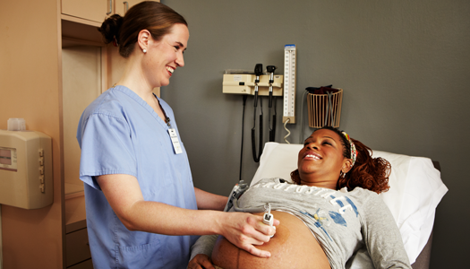 A woman receives an ultrasound test as part of her prenatal care
