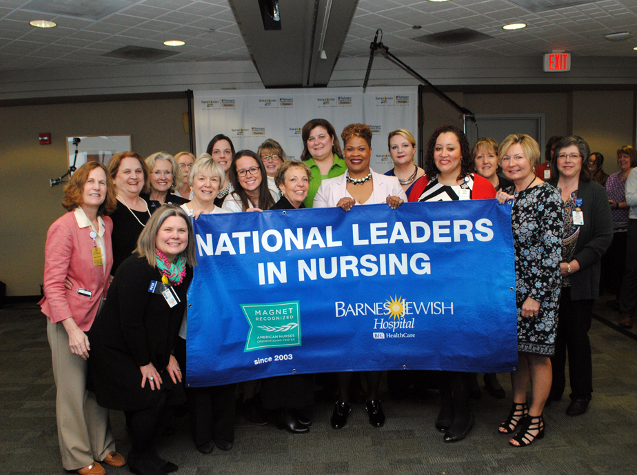 Nurses at Barnes-Jewish Hospital proudly holding an excellence in nursing banner Nurses at Barnes-Jewish Hospital proudly holding an excellence in nursing banner